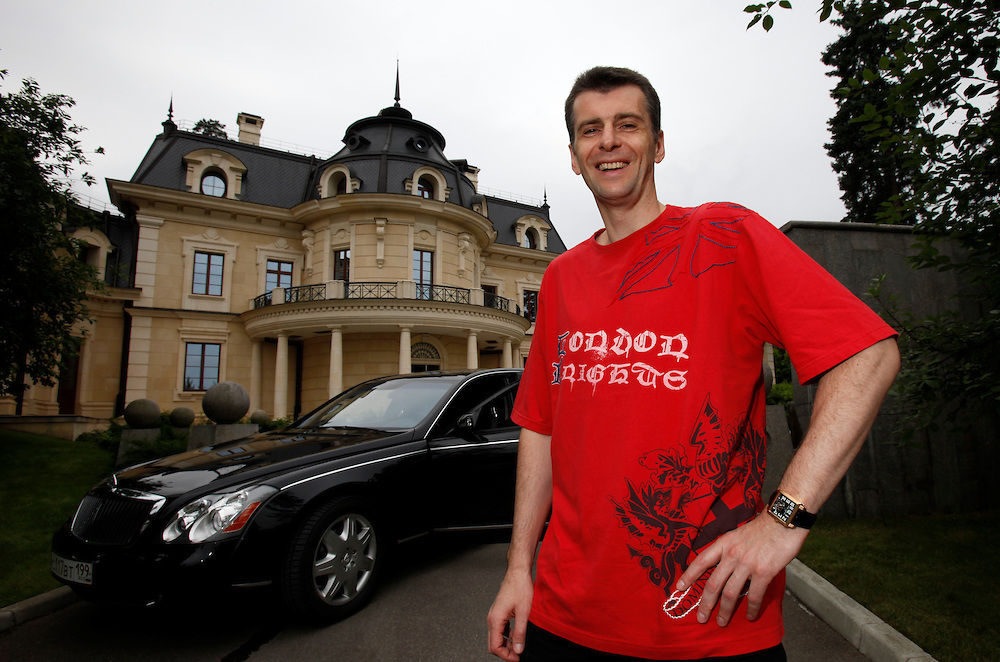 Mikhail Prokhorov, Russia's richest man in 2009, poses in front of his Maybach car at his country residence outside central Moscow. Prokorov made his fortune in investments. In 2009 Forbes estimates his net worth to be USD9.5 billion, making him the world's 40th richest person. Prokhorov is a bachelor and loves kickboxing. Prokhorov sold his 25% stake in Norilsk Nickel to fellow billionaire Oleg Deripaska. He also stepped down as general director of metals outfit Norilsk two year ago after being detained on suspicions that he allegedly made prostitutes available to guests he was entertaining in the glitzy French ski resort Courchevel; though he was never charged. Soon after that, he split with his longtime partner, Vladimir Potanin.